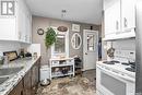 502 12Th Street Nw, Prince Albert, SK  - Indoor Photo Showing Kitchen With Double Sink 