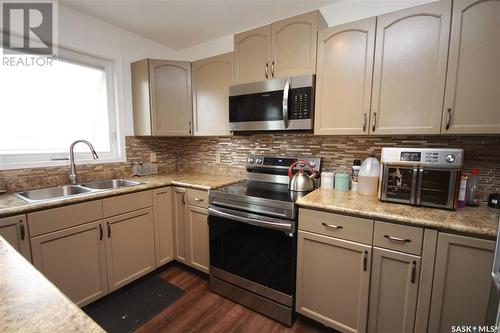10328 Hock Avenue, North Battleford, SK - Indoor Photo Showing Kitchen With Double Sink