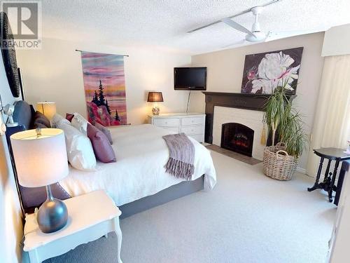 9081 Stager Road, Powell River, BC - Indoor Photo Showing Bedroom With Fireplace