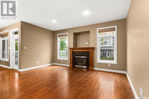 134 Wintergreene Lane, Regina, SK - Indoor Photo Showing Living Room With Fireplace