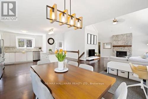 1078 Buckeye Road, Muskoka Lakes, ON - Indoor Photo Showing Dining Room With Fireplace