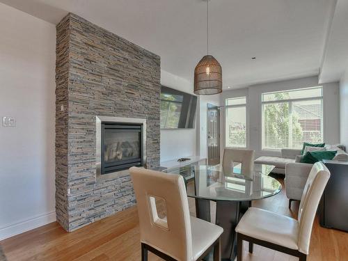 Dining room - 2800 Rue Des Francs-Bourgeois, Boisbriand, QC - Indoor Photo Showing Dining Room With Fireplace