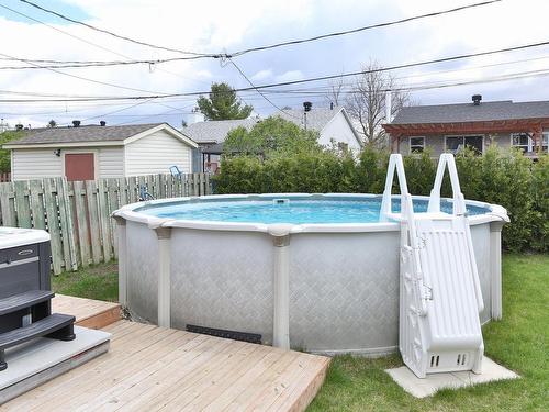 Pool - 35 Rue Champagne, Saint-Constant, QC - Outdoor With Above Ground Pool