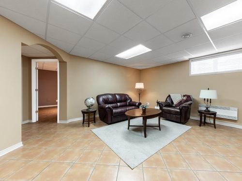 Salle familiale - 509 Rue Du Pain-De-Sucre, Mont-Saint-Hilaire, QC - Indoor Photo Showing Basement