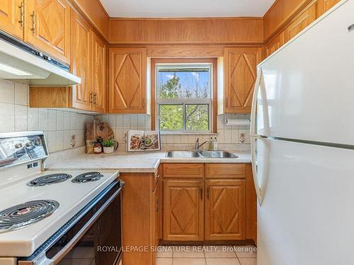 34 William Cragg Dr, Toronto, ON - Indoor Photo Showing Kitchen With Double Sink