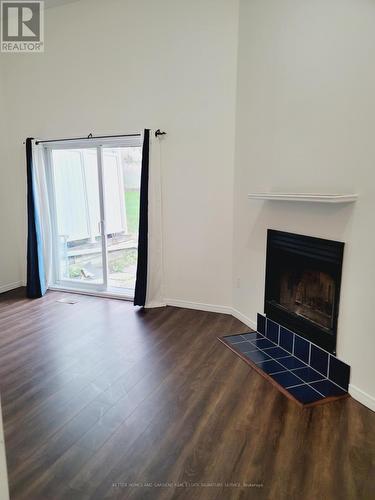 8 - 589 Beechwood Drive, Waterloo, ON - Indoor Photo Showing Living Room With Fireplace