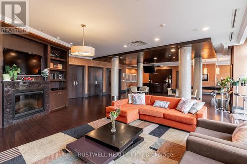 222 - 39 Upper Duke Crescent, Markham, ON - Indoor Photo Showing Living Room With Fireplace