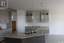 830 1St Avenue N, Warman, SK  - Indoor Photo Showing Kitchen With Double Sink 