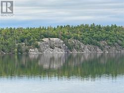 OPPOSITE SHORELINE IS ALL CROWN LAND, AFFORDING TREMENDOUS PRIVACY AND TRANQUILITY - 