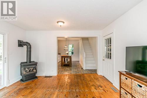 70 Yonge Street N, Springwater, ON - Indoor With Fireplace