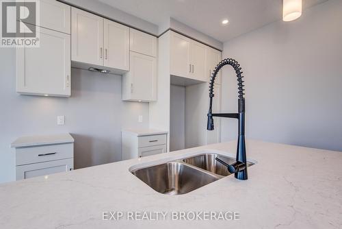 100 Thackeray Way, Minto, ON - Indoor Photo Showing Kitchen With Double Sink