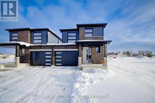 102 Thackeray Way, Minto, ON - Outdoor With Facade