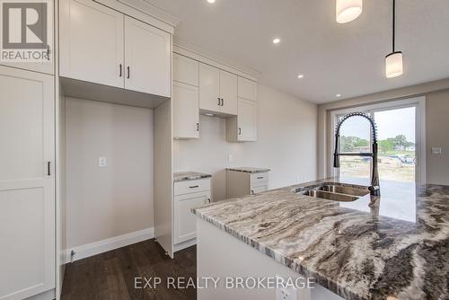 102 Thackeray Way, Minto, ON - Indoor Photo Showing Kitchen With Double Sink