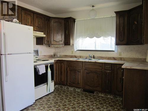 703 Golburn Crescent, Tisdale, SK - Indoor Photo Showing Kitchen With Double Sink