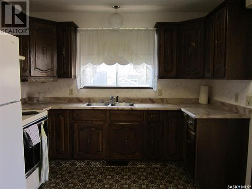 703 Golburn Crescent, Tisdale, SK - Indoor Photo Showing Kitchen With Double Sink