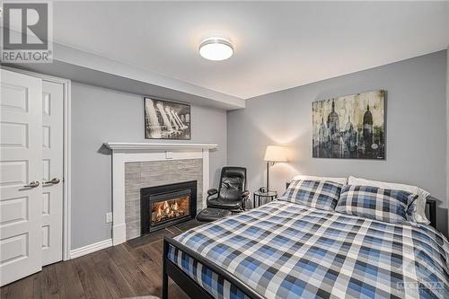 357 Huron Avenue S, Ottawa, ON - Indoor Photo Showing Bedroom With Fireplace