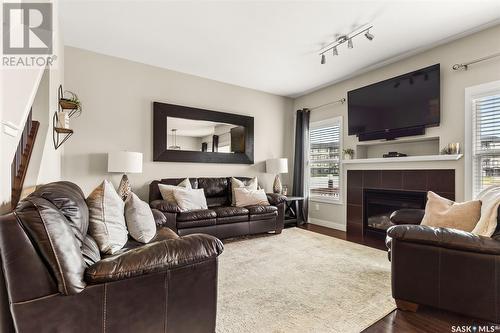 153 Poplar Bluff Crescent, Regina, SK - Indoor Photo Showing Living Room With Fireplace