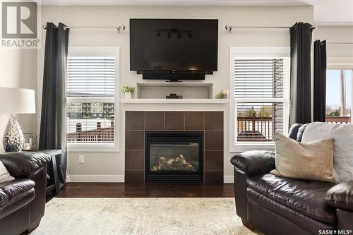 153 Poplar Bluff Crescent, Regina, SK - Indoor Photo Showing Living Room With Fireplace