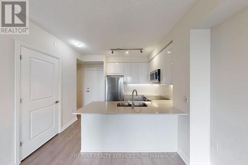 618 - 50 Thomas Riley Road, Toronto, ON - Indoor Photo Showing Kitchen With Double Sink