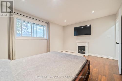 433 Murray Street, Grimsby, ON - Indoor Photo Showing Bedroom With Fireplace