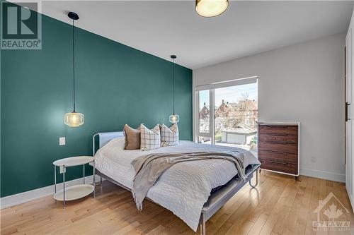 Th primary suite has a window and space for a king sized bed. - 163 Irving Avenue, Ottawa, ON - Indoor Photo Showing Bedroom