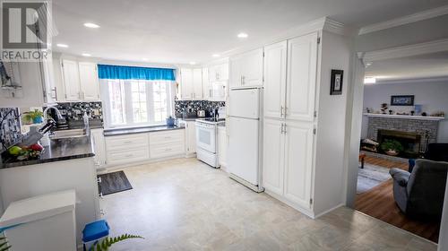 4 Little Harbour Road, Fogo, NL - Indoor Photo Showing Kitchen With Fireplace