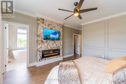 2181 Northeys Road, Smith-Ennismore-Lakefield, ON - Indoor Photo Showing Bedroom With Fireplace