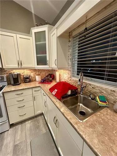 23 Grassland Crescent, Brandon, MB - Indoor Photo Showing Kitchen With Double Sink