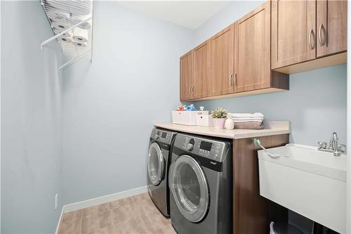 99 Blue Sun Drive, Winnipeg, MB - Indoor Photo Showing Laundry Room