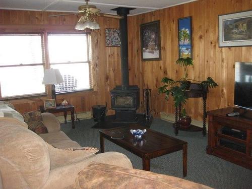 51 Grant Drive, Rainy River, ON - Indoor Photo Showing Living Room With Fireplace
