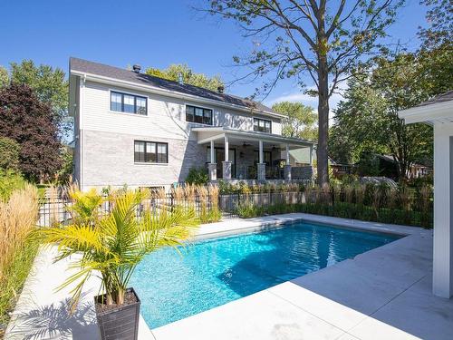 Back facade - 1895 Rue De Cambrai, Saint-Bruno-De-Montarville, QC - Outdoor With In Ground Pool With Deck Patio Veranda