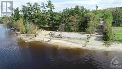 The Grove "Private Beach & Boat Launch strictly for Residents Only in this friendly waterfront community only 30 minutes from Kanata! - 416 Maclarens Side Road, Woodlawn, ON - Outdoor With Body Of Water With View