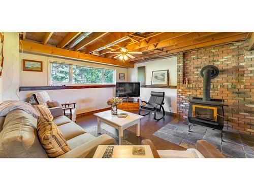 2575 Sinclair Rd, Lister, BC - Indoor Photo Showing Living Room With Fireplace