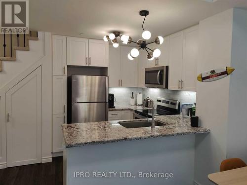 12 - 100 Long Branch Avenue, Toronto, ON - Indoor Photo Showing Kitchen With Stainless Steel Kitchen With Upgraded Kitchen