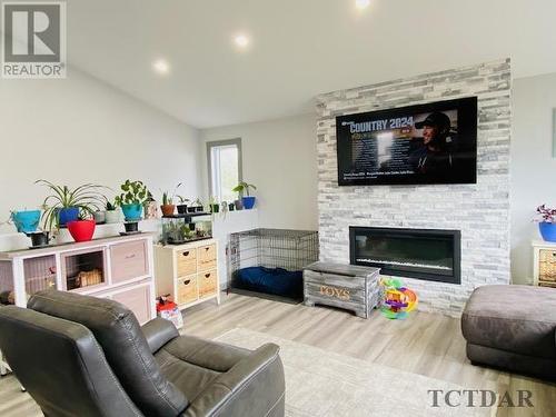 23 Lemarier St, Kapuskasing, ON - Indoor Photo Showing Living Room With Fireplace