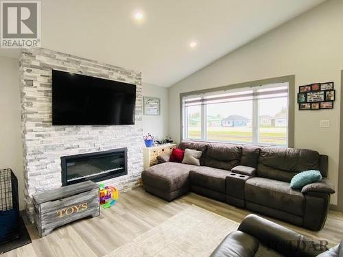 23 Lemarier St, Kapuskasing, ON - Indoor Photo Showing Living Room With Fireplace