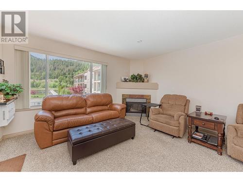 1002 Riverside Avenue Unit# 203, Sicamous, BC - Indoor Photo Showing Living Room With Fireplace