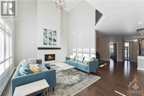 717 Wooler Place, Ottawa, ON - Indoor Photo Showing Living Room With Fireplace