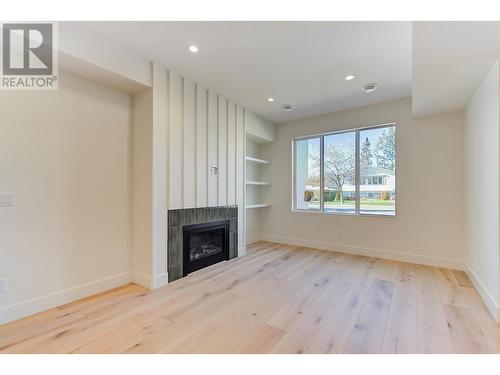 857 Kinnear Court, Kelowna, BC - Indoor Photo Showing Other Room With Fireplace
