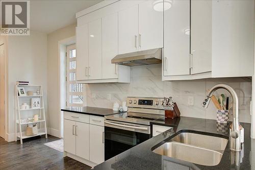 3410 Chocolate Lily Lane, Kelowna, BC - Indoor Photo Showing Kitchen With Double Sink