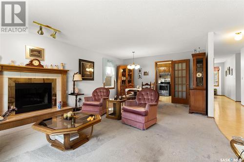 2214 Assiniboine Avenue E, Regina, SK - Indoor Photo Showing Living Room With Fireplace