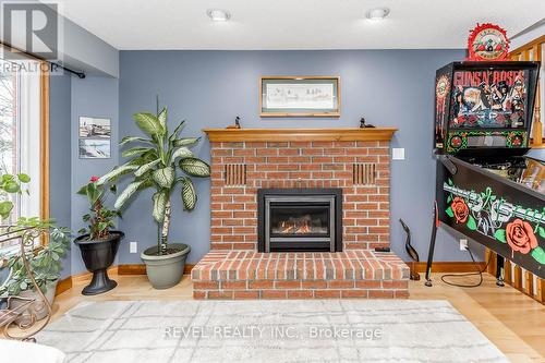 8 Willow Drive, Tiny, ON - Indoor Photo Showing Other Room With Fireplace