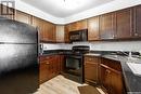 215 2351 Windsor Park Road, Regina, SK  - Indoor Photo Showing Kitchen With Double Sink 