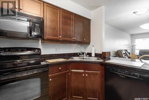 215 2351 Windsor Park Road, Regina, SK - Indoor Photo Showing Kitchen With Double Sink