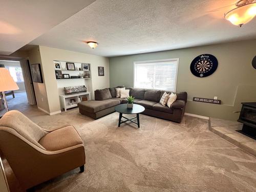 244 The Ridgeway, Princeton, BC - Indoor Photo Showing Living Room With Fireplace