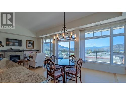 3301 Skaha Lake Road Unit# 805, Penticton, BC - Indoor Photo Showing Dining Room With Fireplace