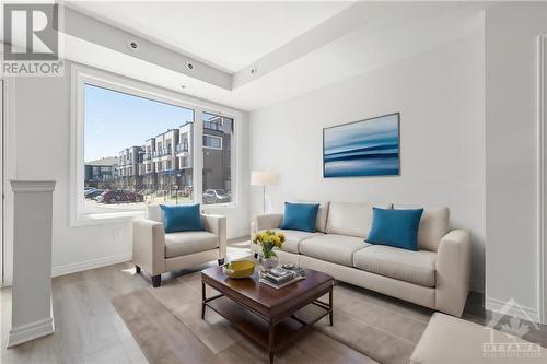 This photo has been virtually staged. - 569 Takamose Private, Ottawa, ON - Indoor Photo Showing Living Room