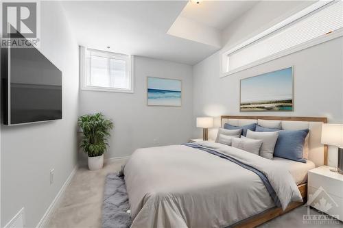 This photo has been virtually staged. - 569 Takamose Private, Ottawa, ON - Indoor Photo Showing Bedroom