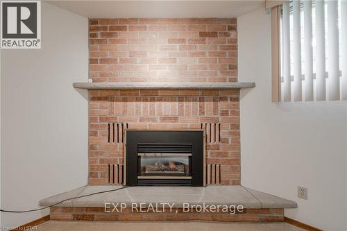 107 River Run Terrace, London, ON - Indoor Photo Showing Living Room With Fireplace