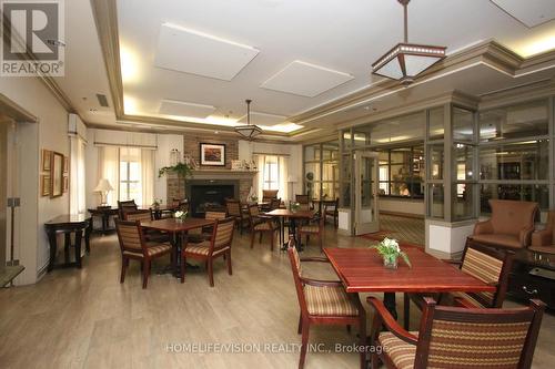 2405 - 100 Burloak Drive, Burlington, ON - Indoor Photo Showing Dining Room With Fireplace